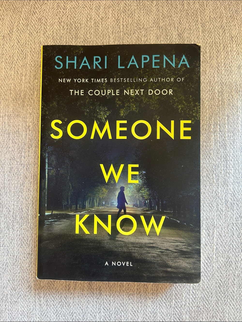 Someone We Know by Shari Lapena - Yellow & Black Paperback Novel